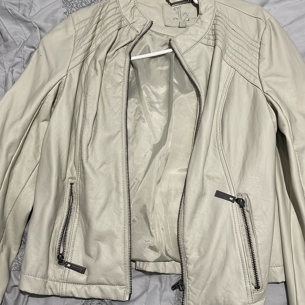 Cream leather jacket.